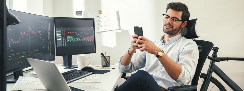 Stock trader relaxing in a chair waiting for a trading opportunity