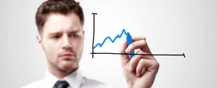 Man drawing a blue line on a chart