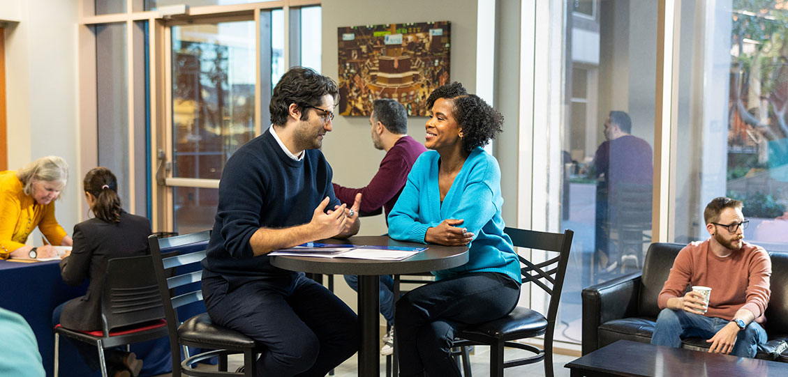 Members talking in a Trading Academy center